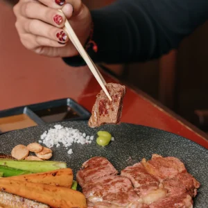 Romantic trip in Bali at Shinraku Teppanyaki. Enjoy the sizzling fire, chef's mastery, and juicy & tender grilled beef.
